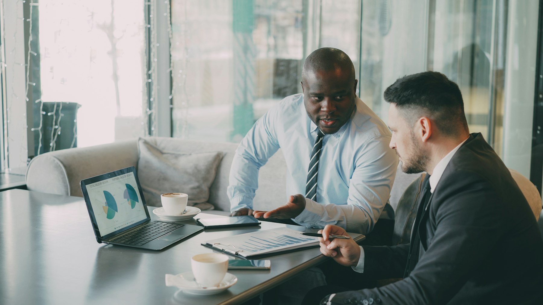 Business leaders reviewing performance charts